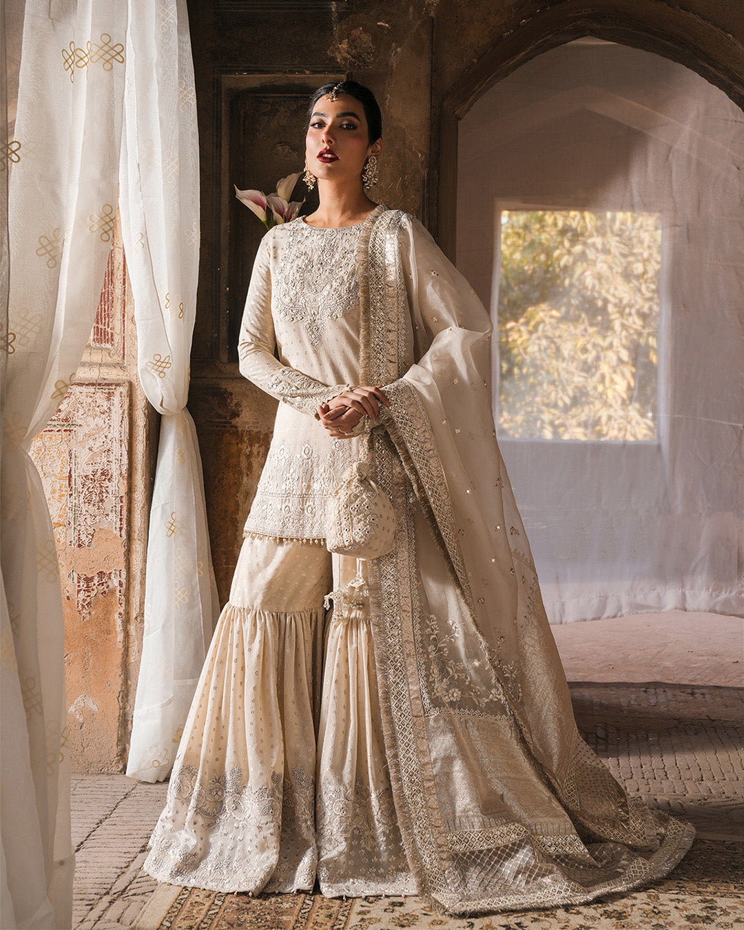 Model Wearing Faiza Saqlain Devina Off-White Shirt with Gharara for wedding wear - Pakistani Designer Wear for Women in UK | Kifat