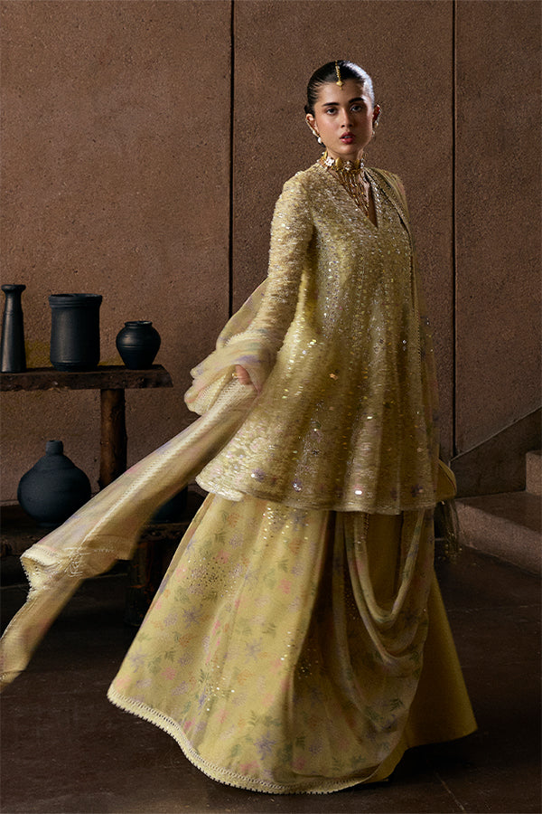 Model Wearing Suffuse by Sana Yasir Merivah Butter Yellow Peplum with Sharara Pants for Wedding Wear - Pakistani Designer wear for Women in UK | Kifat