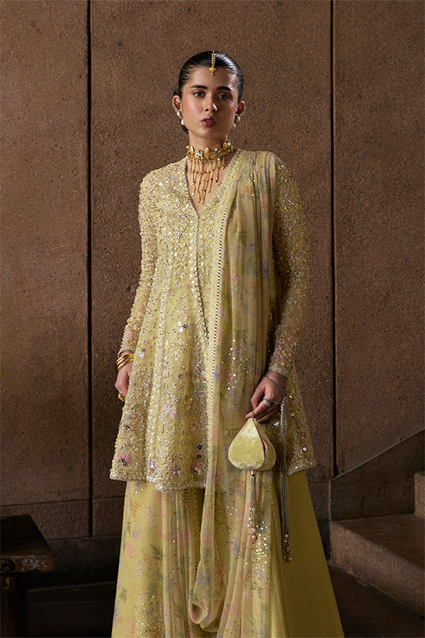 Model Wearing Suffuse by Sana Yasir Merivah Butter Yellow Peplum with Sharara Pants for Wedding Wear - Pakistani Designer wear for Women in UK | Kifat