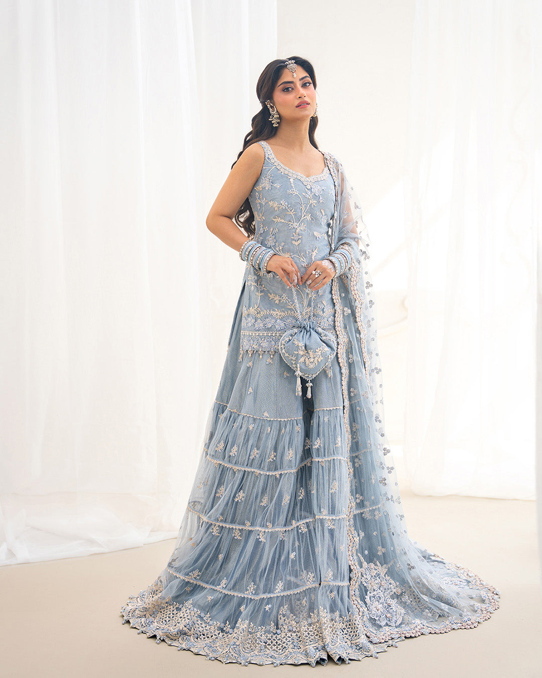 Model Wearing Faiza Saqlain Oya Ice Blue Shirt with Gharara for wedding wear - Pakistani Designer Wear for Women in UK | Kifat