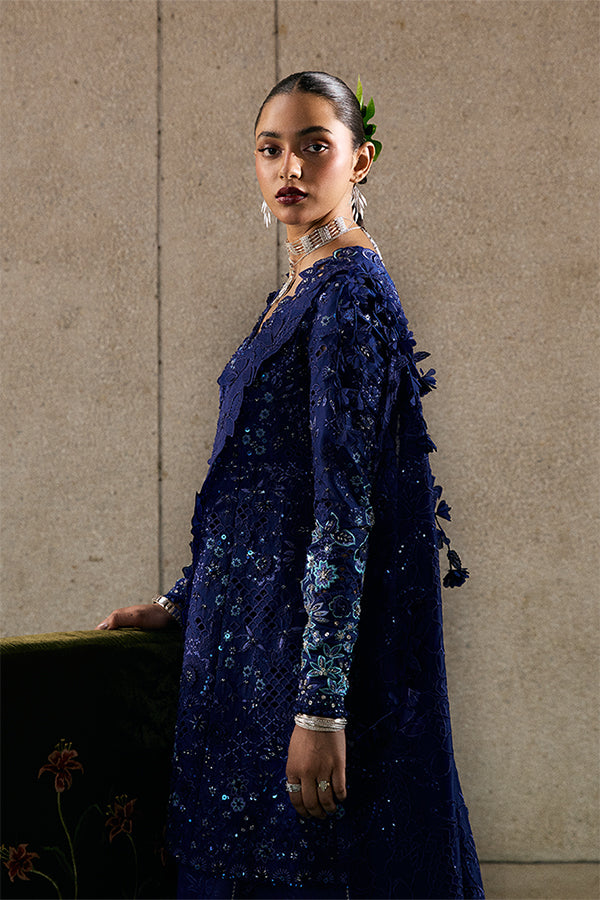 Model Wearing Suffuse by Sana Yasir Freyssa Indigo blue Angrakha with Sharara Pants for Wedding Wear - Pakistani Designer wear for Women in UK | Kifat