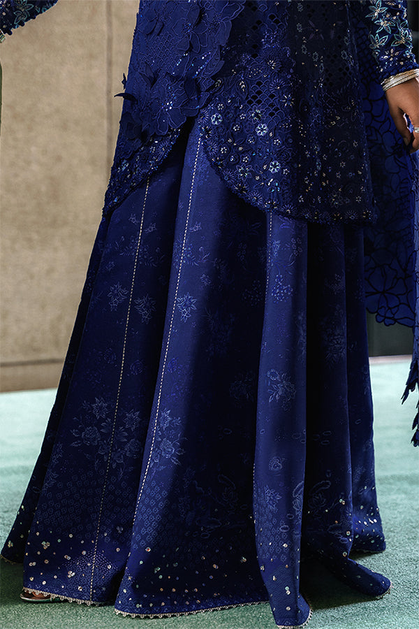 Model Wearing Suffuse by Sana Yasir Freyssa Indigo blue Angrakha with Sharara Pants for Wedding Wear - Pakistani Designer wear for Women in UK | Kifat