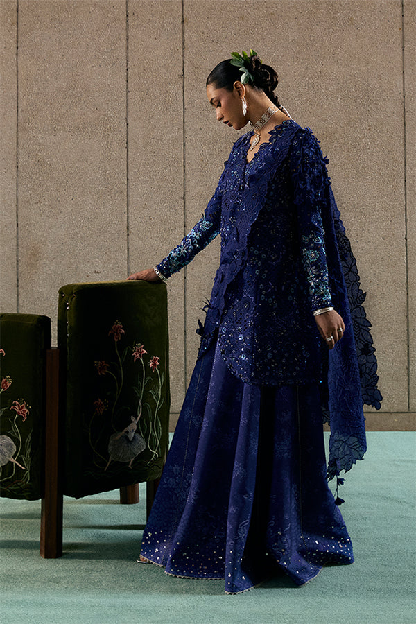 Model Wearing Suffuse by Sana Yasir Freyssa Indigo blue Angrakha with Sharara Pants for Wedding Wear - Pakistani Designer wear for Women in UK | Kifat