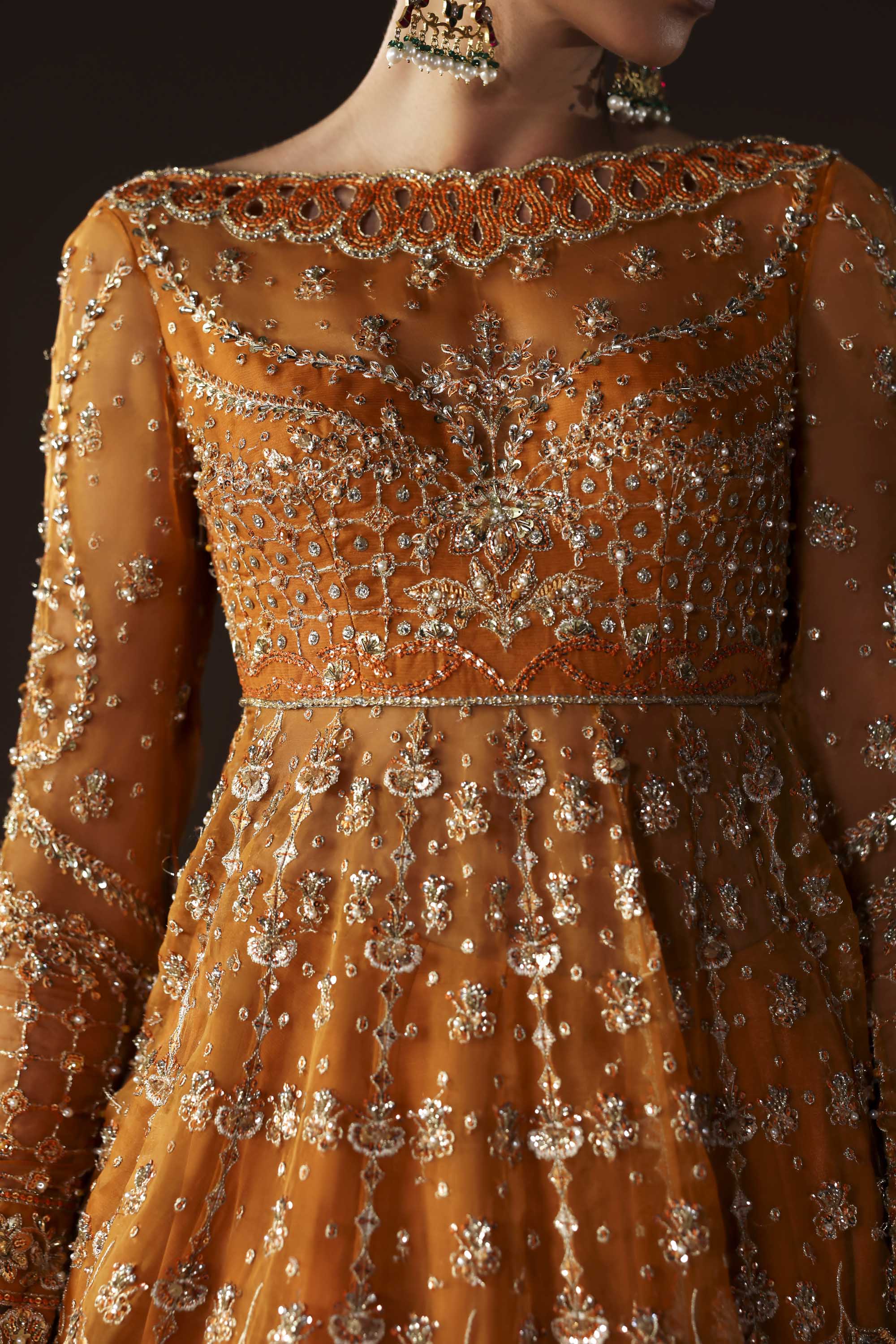Women Wearing Muselet Orange Peshwas For Luxury Formals Events - Pakistani Designer Wear For Women In UK | Kifat
