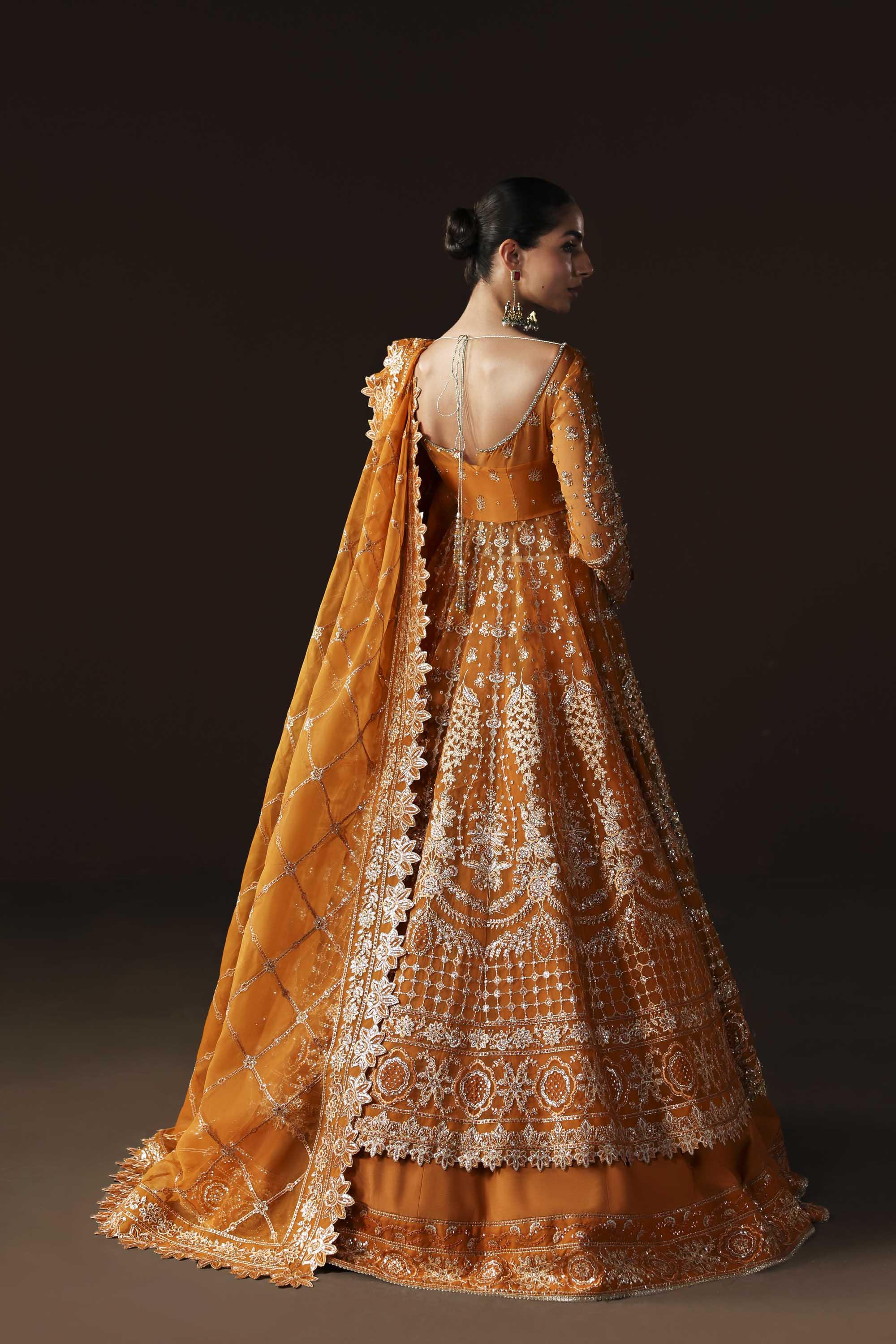 Women Wearing Muselet Orange Peshwas For Luxury Formals Events - Pakistani Designer Wear For Women In UK | Kifat