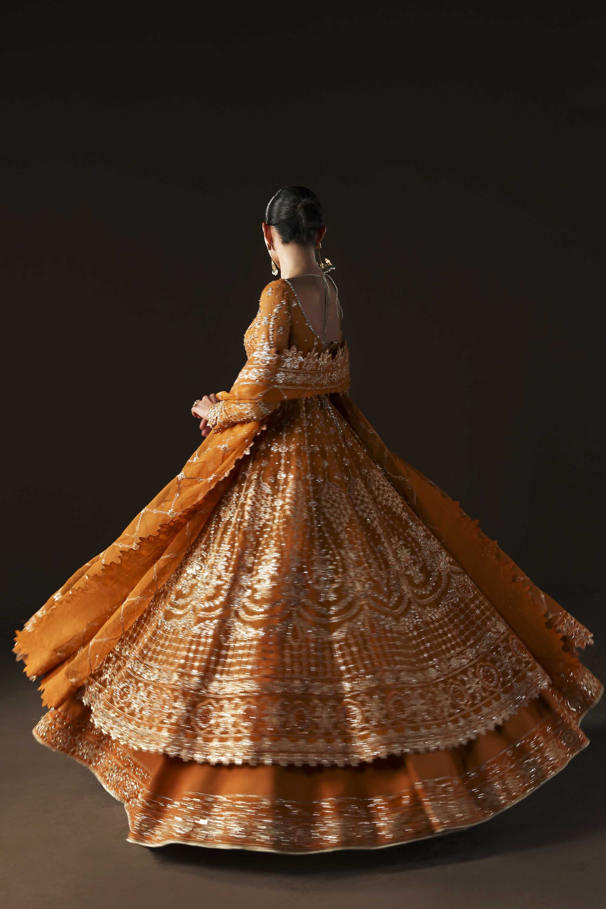 Women Wearing Muselet Orange Peshwas For Luxury Formals Events - Pakistani Designer Wear For Women In UK | Kifat