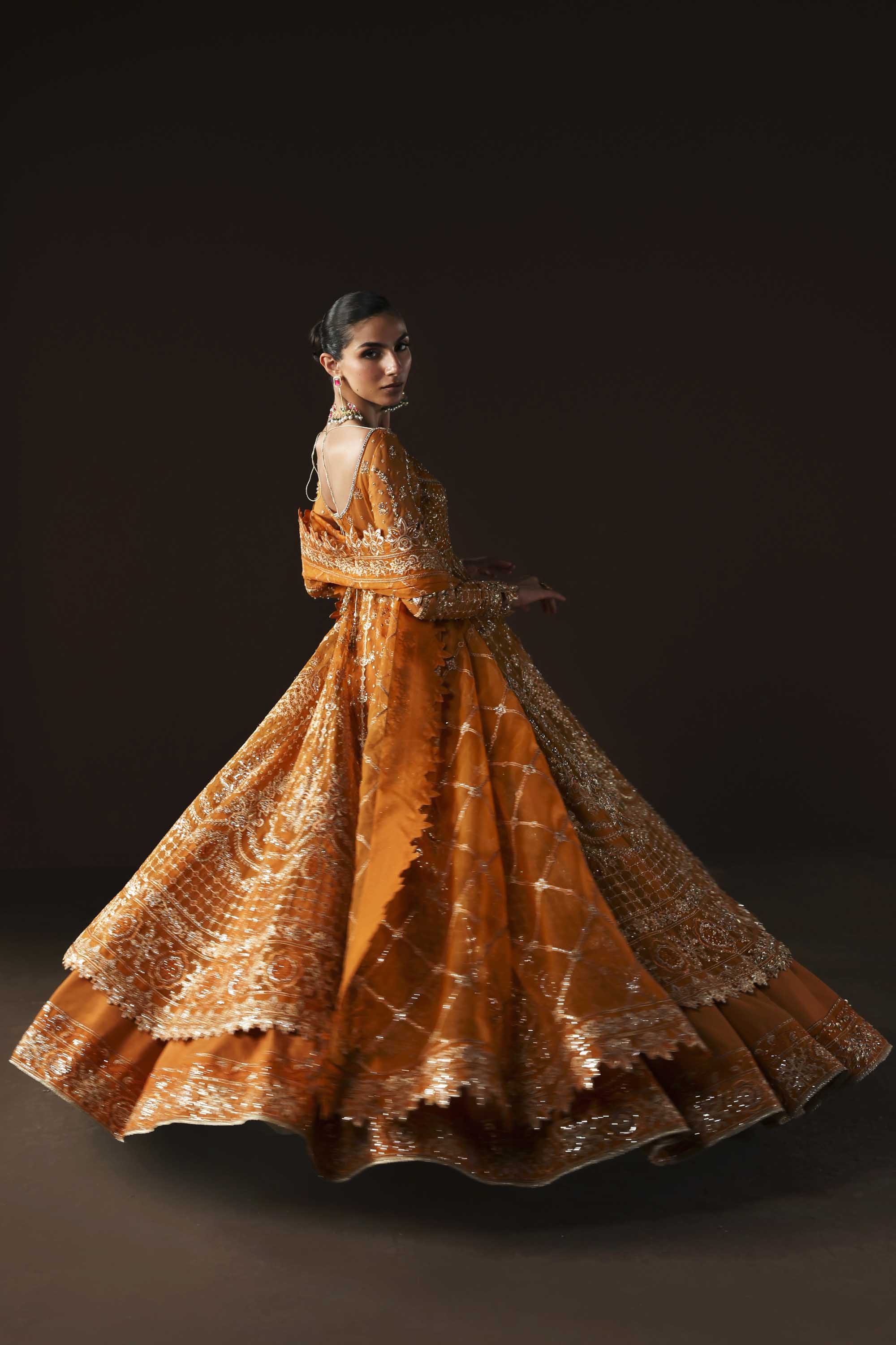 Women Wearing Muselet Orange Peshwas For Luxury Formals Events - Pakistani Designer Wear For Women In UK | Kifat