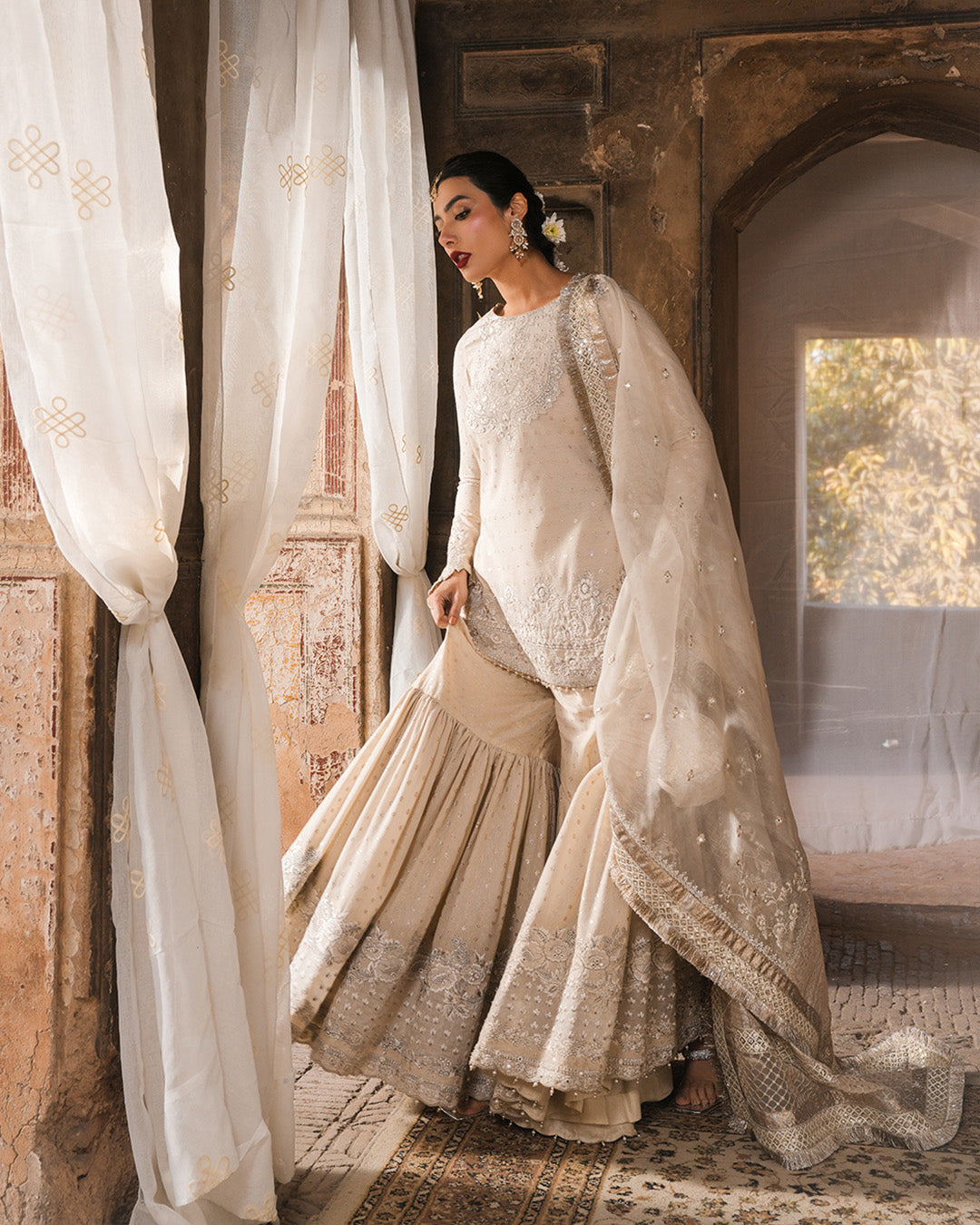 Model Wearing Faiza Saqlain Devina Off-White Shirt with Gharara for wedding wear - Pakistani Designer Wear for Women in UK | Kifat