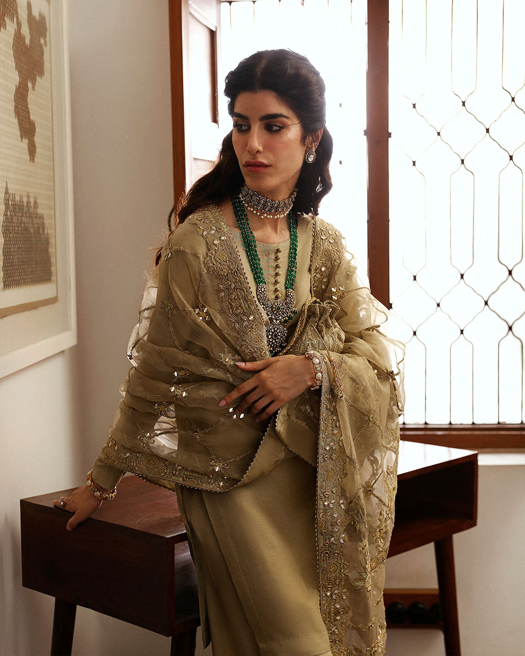 Model Wearing Faiza Saqlain Nainsi Gold Shirt with Flared Pants for formal events wear - Pakistani Designer Wear for Women in UK | Kifat