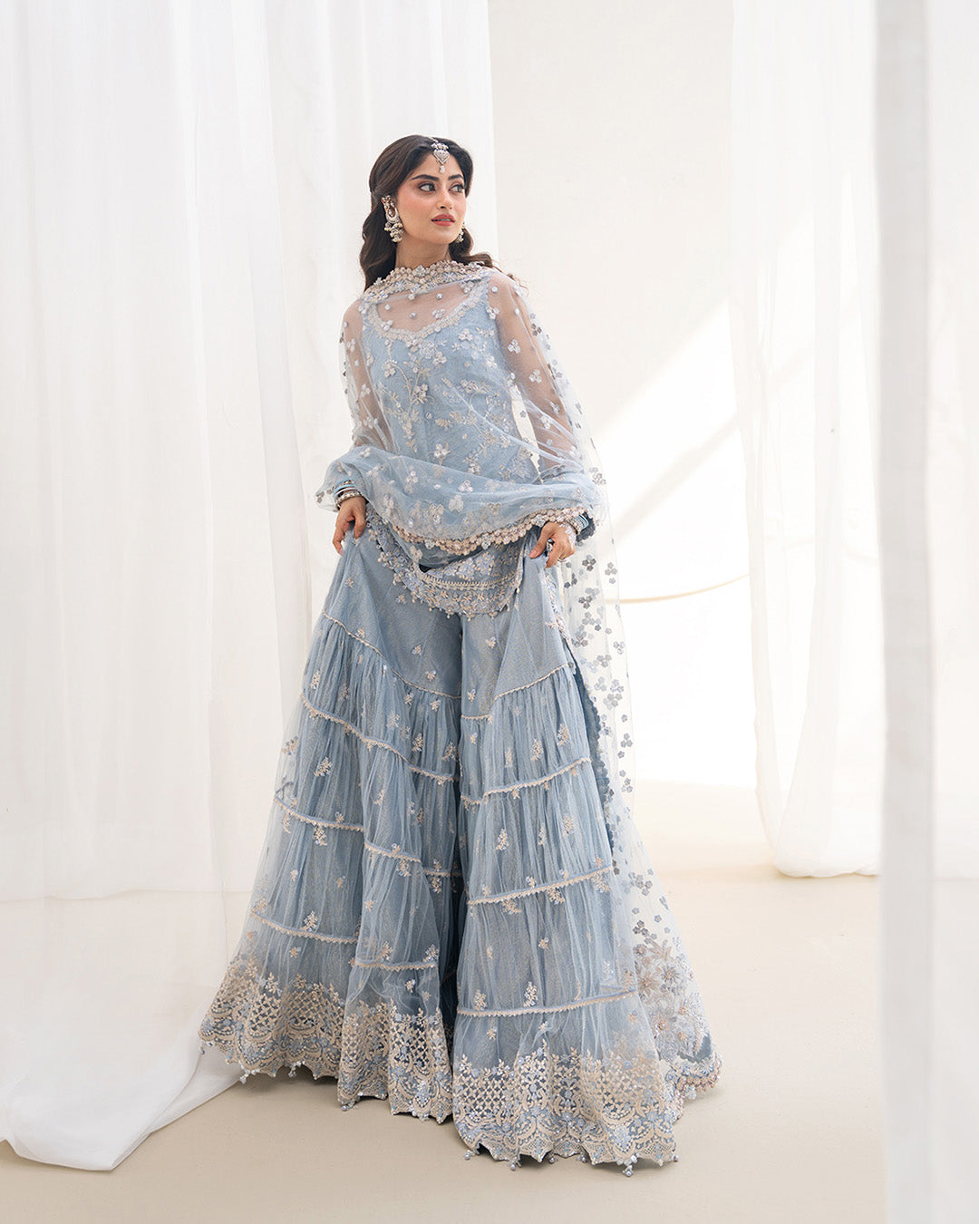 Model Wearing Faiza Saqlain Oya Ice Blue Shirt with Gharara for wedding wear - Pakistani Designer Wear for Women in UK | Kifat