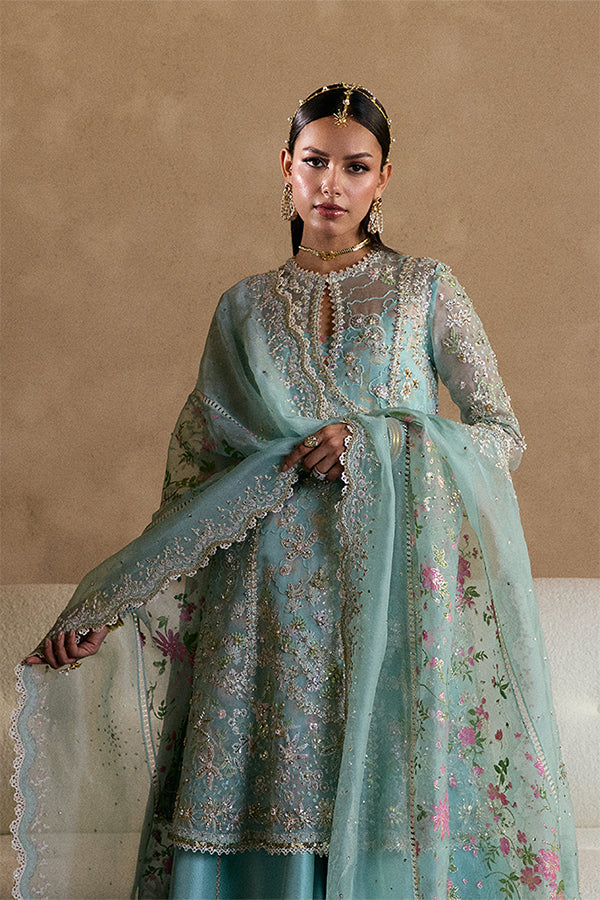 Model Wearing Suffuse by Sana Yasir Illyra Aquamarine Angrakha with Sharara Pants for Wedding Wear - Pakistani Designer wear for Women in UK | Kifat