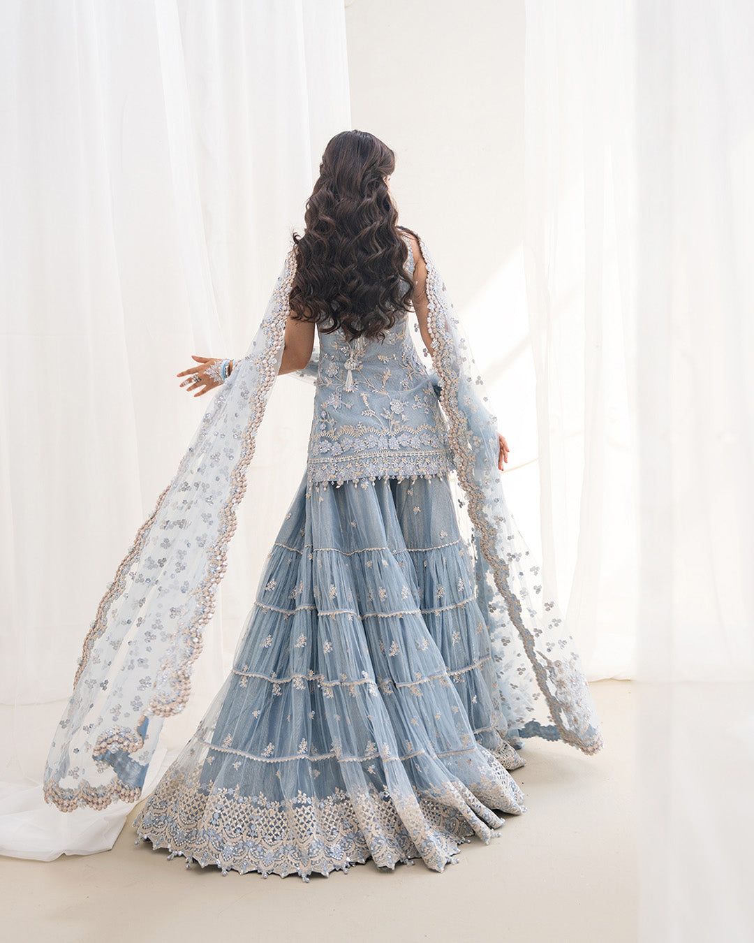 Model Wearing Faiza Saqlain Oya Ice Blue Shirt with Gharara for wedding wear - Pakistani Designer Wear for Women in UK | Kifat