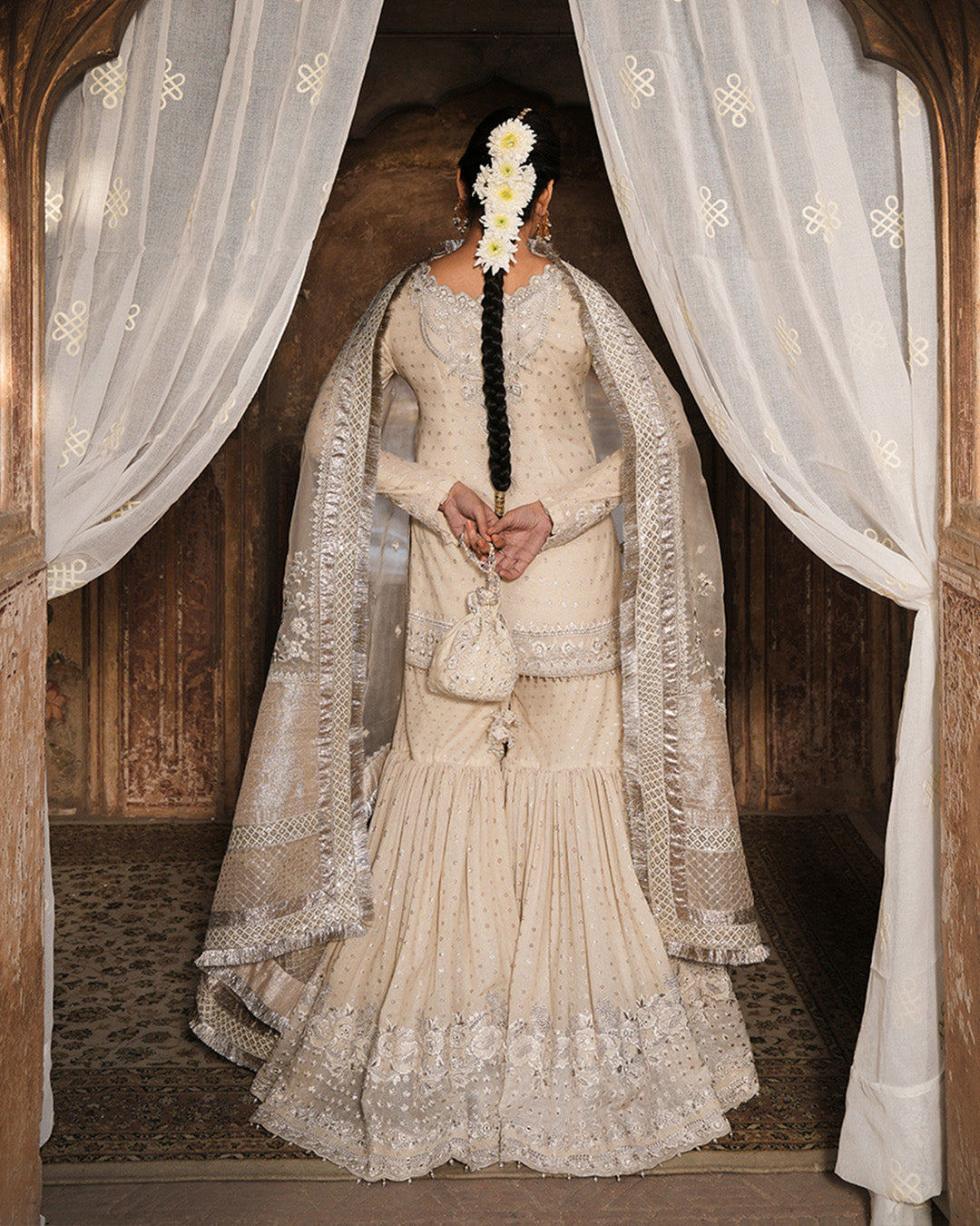 Model Wearing Faiza Saqlain Devina Off-White Shirt with Gharara for wedding wear - Pakistani Designer Wear for Women in UK | Kifat