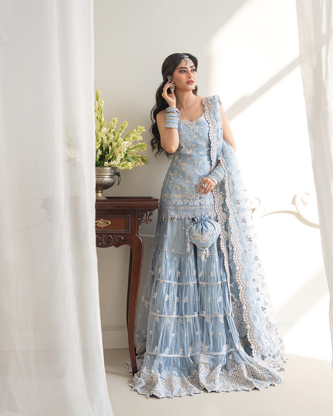 Model Wearing Faiza Saqlain Oya Ice Blue Shirt with Gharara for wedding wear - Pakistani Designer Wear for Women in UK | Kifat