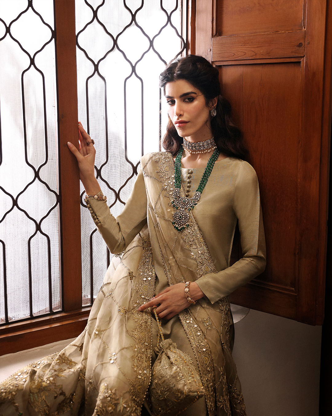 Model Wearing Faiza Saqlain Nainsi Gold Shirt with Flared Pants for formal events wear - Pakistani Designer Wear for Women in UK | Kifat