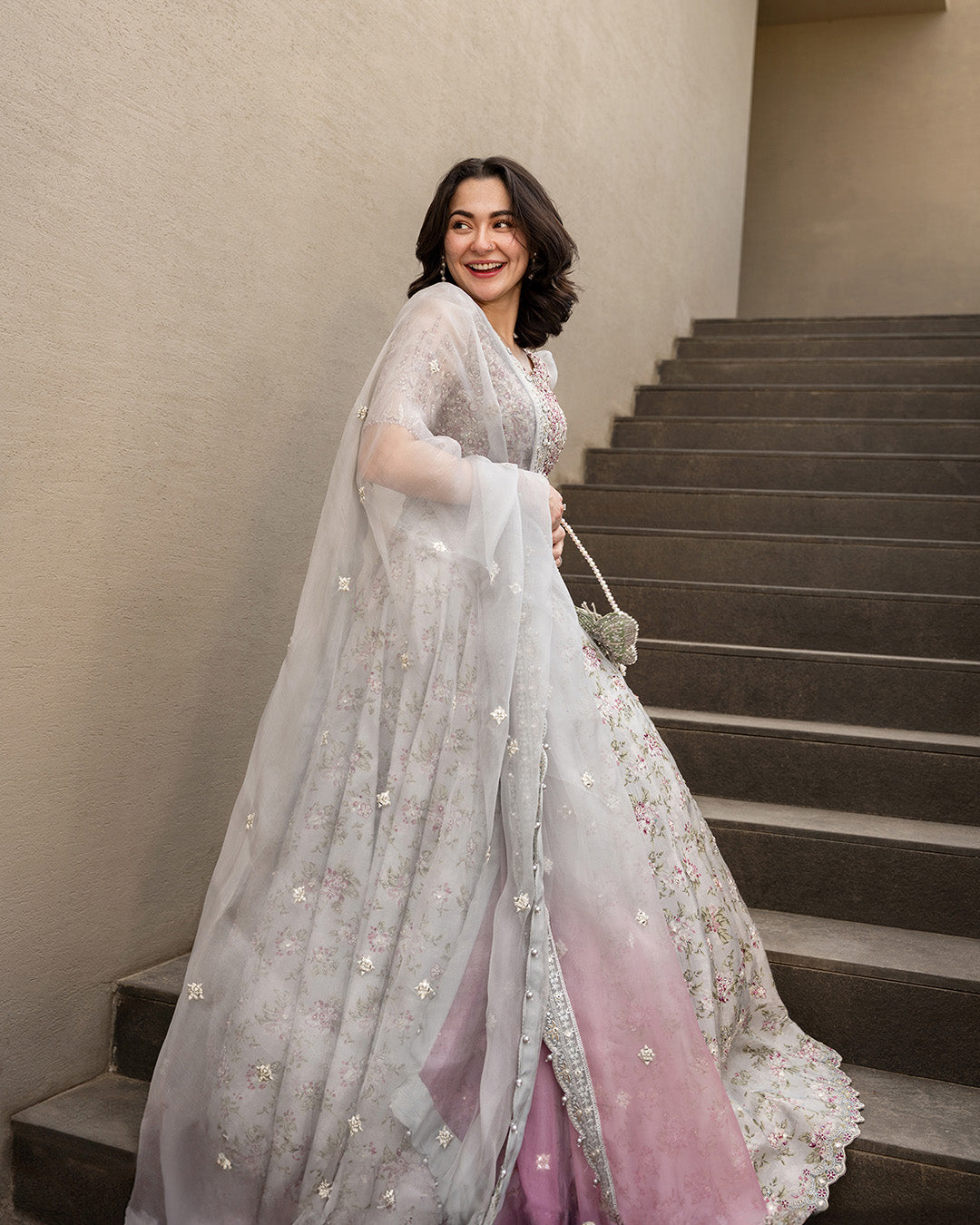 Model Wearing Faiza Saqlain Chanaah Light Grey Lehnga Choli for wedding wear - Pakistani Designer Wear for Women in UK | Kifat